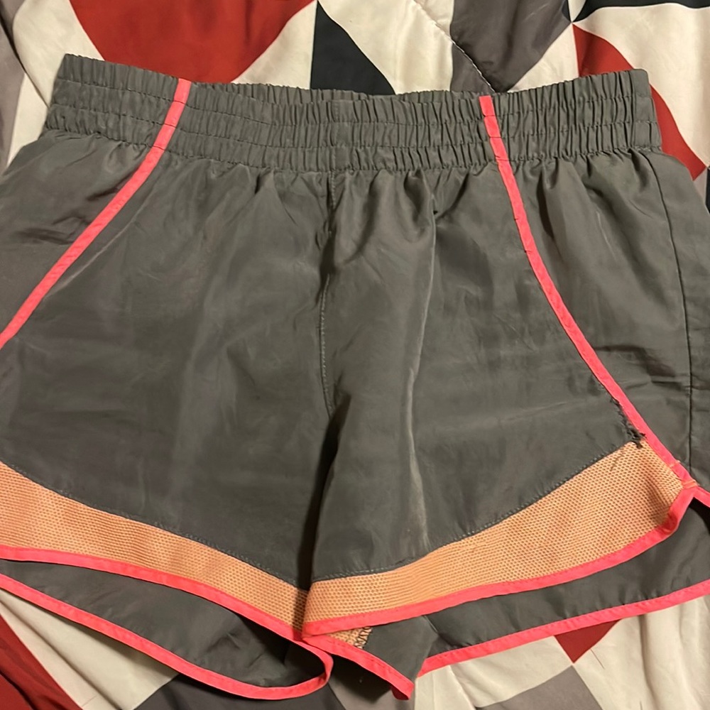 Running shorts size XS used to good condition colors grey,pink,and orange